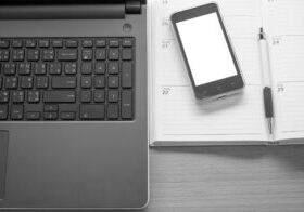 Business Working table with the laptop smartphone and  organizing.